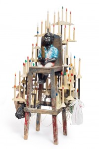 Nick Cave, “Golden Boy” (2014), mixed media including concrete garden ornament, vintage high chair, dildo, and holiday candles, 73 3/4 x 41 x 35 in (© Nick Cave) (photo by James Prinz Photography, courtesy the artist and Jack Shainman Gallery, New York)