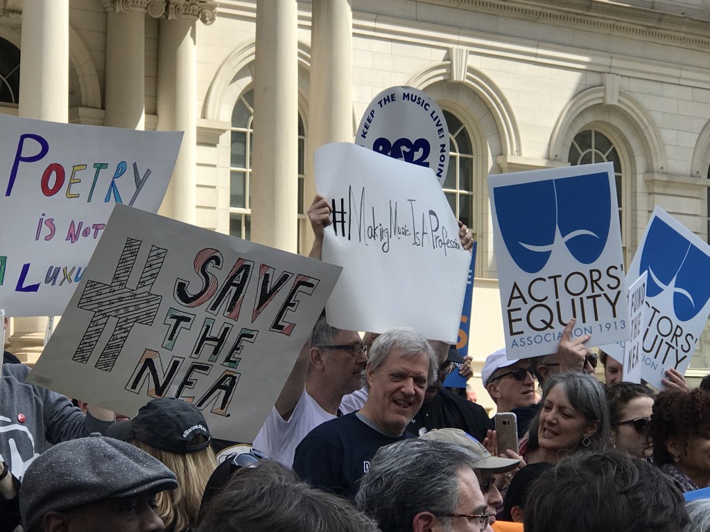 Press Rally with MFM's hashtag sign 